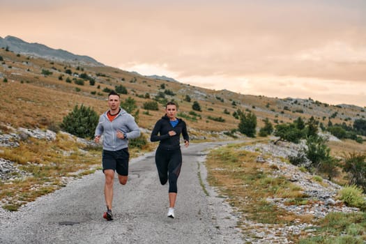 Couple conquer challenging mountain trails during an invigorating morning run.