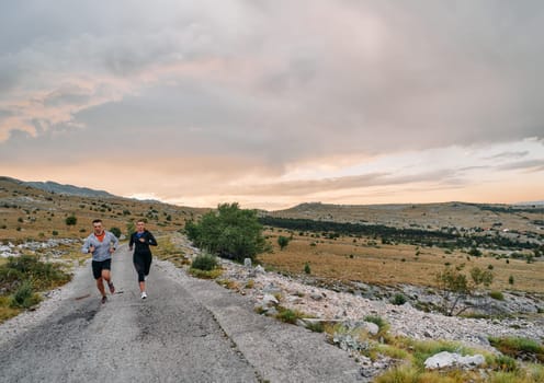 Couple conquer challenging mountain trails during an invigorating morning run.