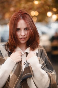 A radiant redhead embracing a hippie-inspired look on a crisp autumn day. High quality photo