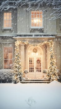 Christmas in the countryside manor, English country house mansion decorated for holidays on a snowy winter evening with snow and holiday lights, Merry Christmas and Happy Holidays design