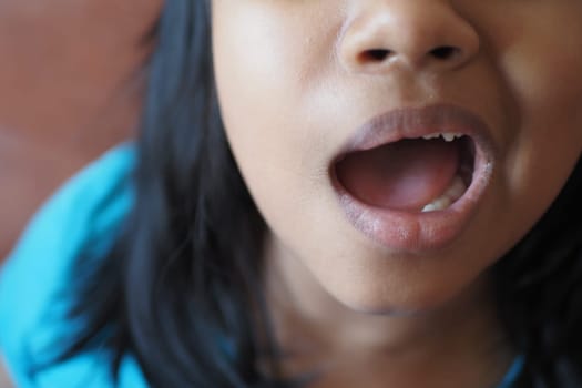 close up of child screaming at home , slow motion