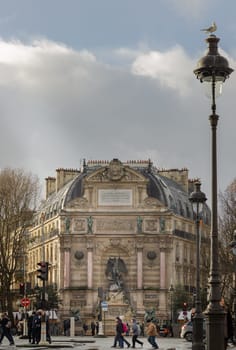 France, Paris - Jan 03, 2024 - Exterior Architecture and Old building design of The Fontaine Saint-Michel with Sculpture of Saint Michael slaying the Devil. City of Paris, Space for text, Selective focus.