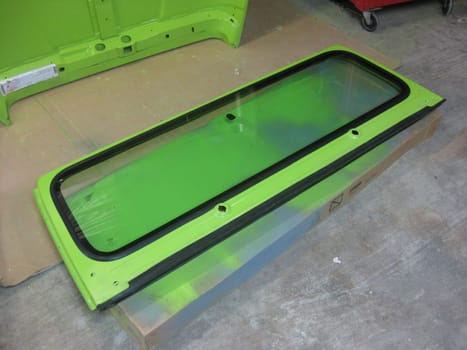 Windshield Auto Body Restoration, Lime Green Paint Job, 1990s Vehicle . High quality photo