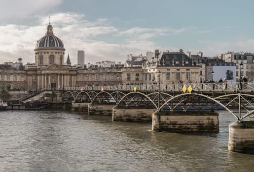 France, Paris - Jan 03, 2024 - Pont des arts (Passerelle des arts) is a pedestrian bridge which across the seine river to The Institut de France in Paris. Space for text, Selective focus.