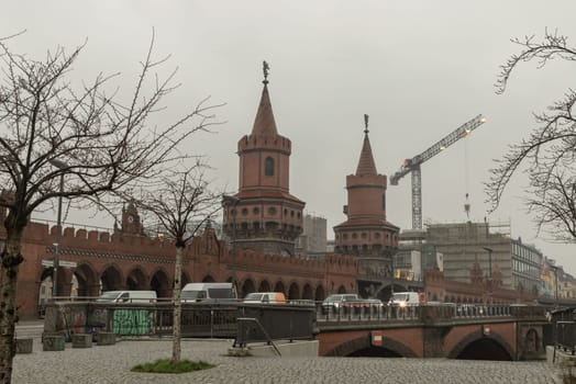 Berlin, Germany - Dec 19, 2023 - Oberbaumbrücke or Oberbaum Bridge over the Spree River in Berlin. East arcades, One of the most important bridges in Berlin. Space for text, Selective focus.