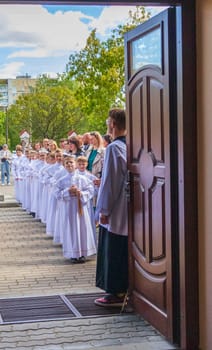 05.05.2024 - Brest, Belarus - People gathered for first communion mass at Roman catholic church.