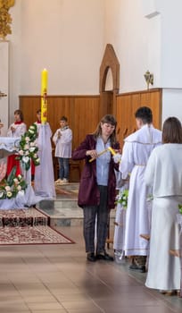 05.05.2024 - Brest, Belarus - People gathered for first communion mass at Roman catholic church.