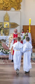 05.05.2024 - Brest, Belarus - People gathered for first communion mass at Roman catholic church.