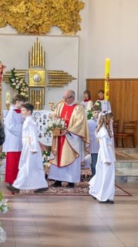 05.05.2024 - Brest, Belarus - People gathered for first communion mass at Roman catholic church.