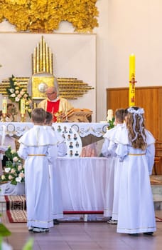 05.05.2024 - Brest, Belarus - People gathered for first communion mass at Roman catholic church.