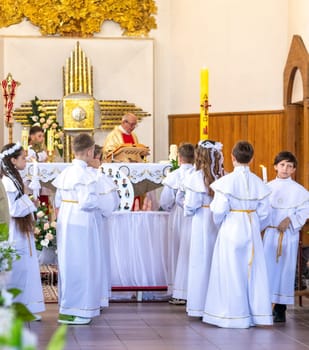 05.05.2024 - Brest, Belarus - People gathered for first communion mass at Roman catholic church.