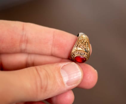 Close up shot of an old, vintage ring with some Latin words in it