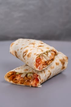 doner with meat filling in a cut on a gray background.