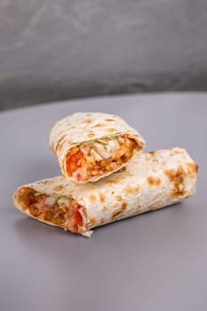 doners in pita bread in a cut on a gray background.