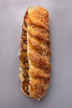 view from top of the sandwich in bread with sesame seeds with mushroom filling.