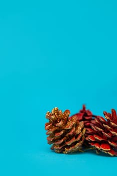 Christmas Pine cones with a Christmas tree on a blue background.