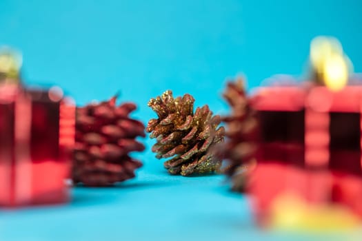 Christmas Pine cones with a Christmas tree on a blue background.
