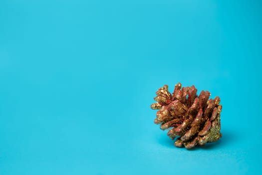 christmas tree toy pine cones on a blue background