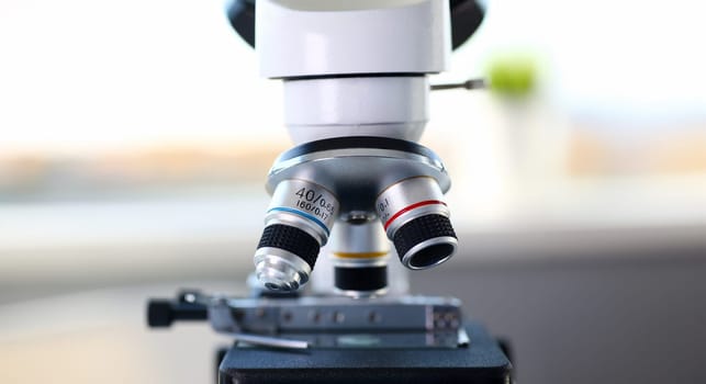 Head microscope on the background laboratory is a study human biology analyzes for non-compliance with the requirements organization public health at international level