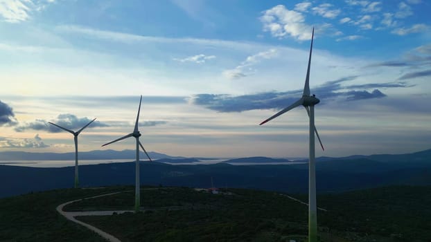 Aerial View of Wind Turbines Energy Production. Futuristic Technology Concept. Digital Network Over Ecology Safe Alternative Energy Source. Renewable energy production for green ecological world. High quality 4k footage