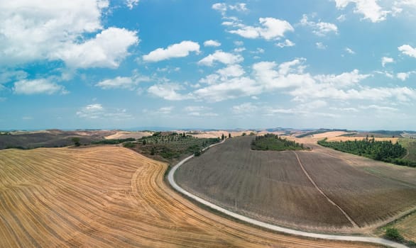 Tuscan landscape on a road of cypress trees near San Quirico d Orcia, Italy