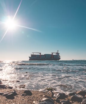 Container cargo ship stands aground after a storm.