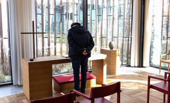 Church room for prayer and privacy with a large cross and chairs for visitors. Herlev hospital, Denmark.