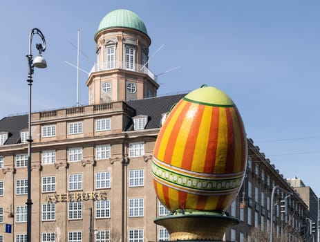 A large decorative Easter egg against a building in the city of Copenhagen, Denmark - March 28, 2024