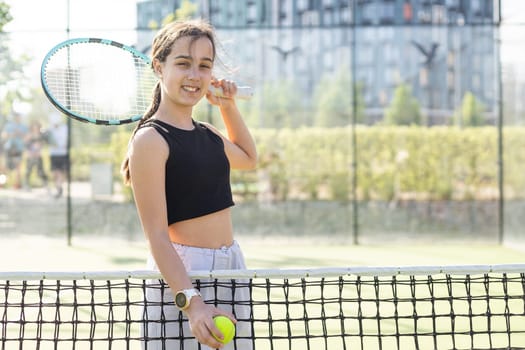 teenage tennis player woman on court with racket. High quality photo