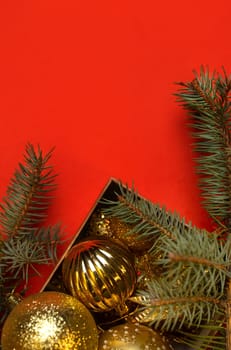 new Year's golden toys on a red background.