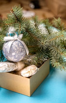 Christmas toys in a box on the background of the Christmas tree.