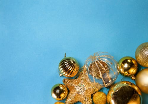 New Year or Christmas backgrounds: golden toys , top view, copy space.