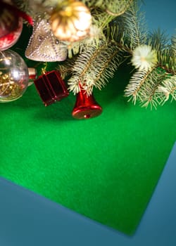 Christmas toys on the Christmas tree on a green background.