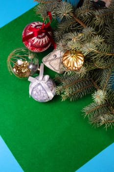 Christmas toys on the Christmas tree on a green background.