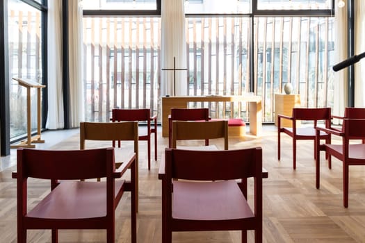Church room for prayer and privacy with a large cross and chairs for visitors. Herlev hospital, Denmark.
