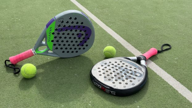 Kyiv, Ukraine, May 15, 2024 paddle tennis racket and balls, padel game kit. High quality photo