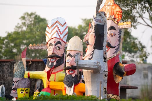 Colorful effigies of demon king Ravan of paper made on the hindu festival of Dussehra Vijayadashami shot with shallow depth of field in India