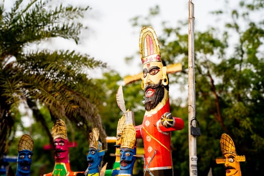 Colorful effigies of demon king Ravan of paper made on the hindu festival of Dussehra Vijayadashami shot with shallow depth of field in India
