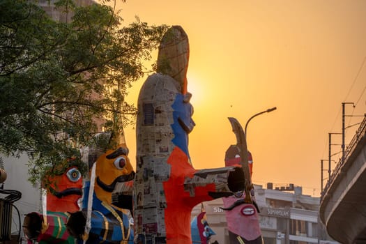 Colorful effigies of demon king Ravan of paper against sunset made on the hindu festival of Dussehra Vijayadashami in India