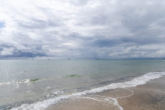 Dramatic seascape in dark colors. Dark sky with clouds over the stormy sea. High quality photo