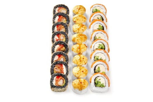 Baked rolls with golden cheese caps, black rice uramaki with tempura shrimp and classic salmon Philadelphia rolls displayed isolated on white background. Japanese style snacks