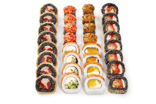 Delightful sushi set of black rice tempura rolls and sesame coated uramaki with tender shrimp tempura, baked norimaki and classic sushi rolls with salmon and mango, arranged on white background