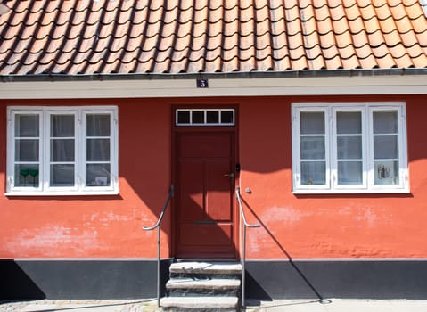 Koge, Denmark - May 1, 2023. Colorful old historic house in a street of Koge City. Traditional Scandinavian houses.