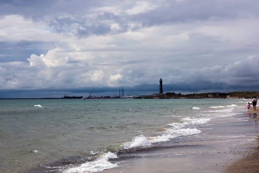 Dramatic seascape in dark colors. Dark sky with clouds over the stormy sea. High quality photo