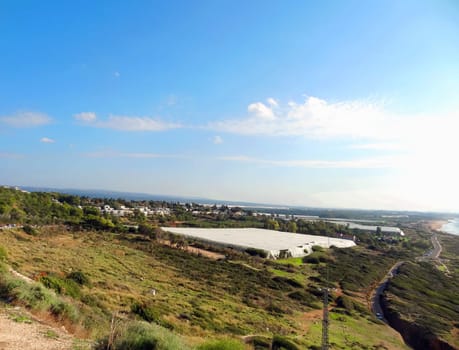 Natural landscape top view of the kibbutz agricultural farm and the Mediterranean Sea, Israel. High quality photo