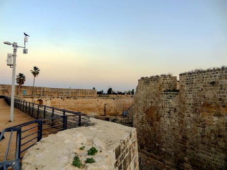 Evening view of the wall fortress of the old city of Akko in Israel. High quality photo