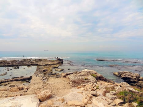 Rocky coast near the ancient Caesarea national park on the Mediterranean coastline, Israel. High quality photo