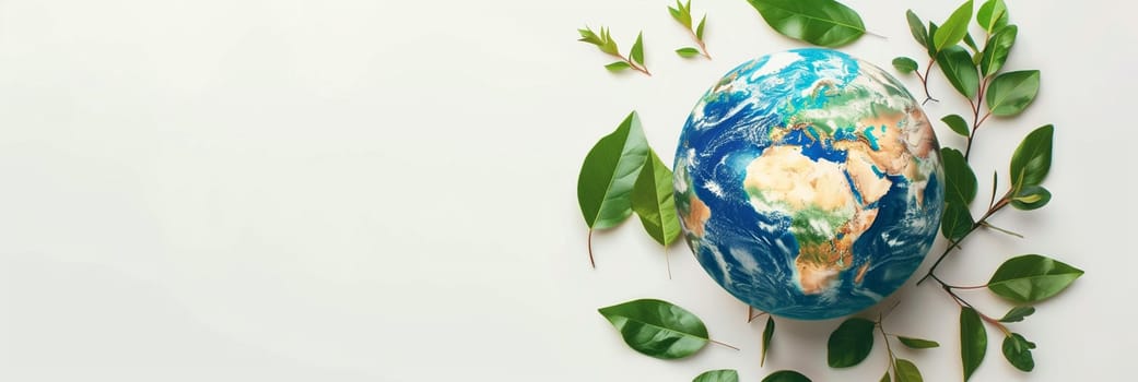 The Earth depicted as being encircled by lush green leaves against a white background, symbolizing the importance of nature and the environment on World Environment Day.