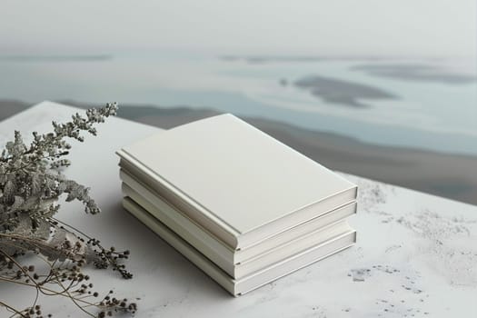 A neat stack of white books is placed on a sleek marble table. Mockup