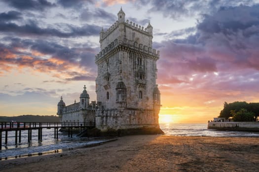 Belem Tower or Tower of St Vincent - famous tourist landmark of Lisboa and tourism attraction - on the bank of the Tagus River Tejo on sunset. Lisbon, Portugal